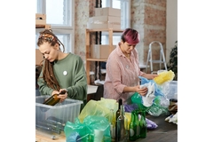 Women sorting through materials.
